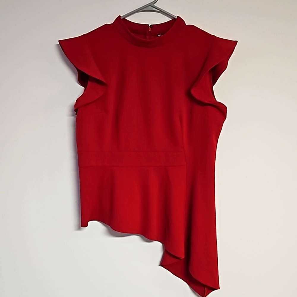Vibrant red top with capped sleeves and asymmetrical bottom. Size xl.